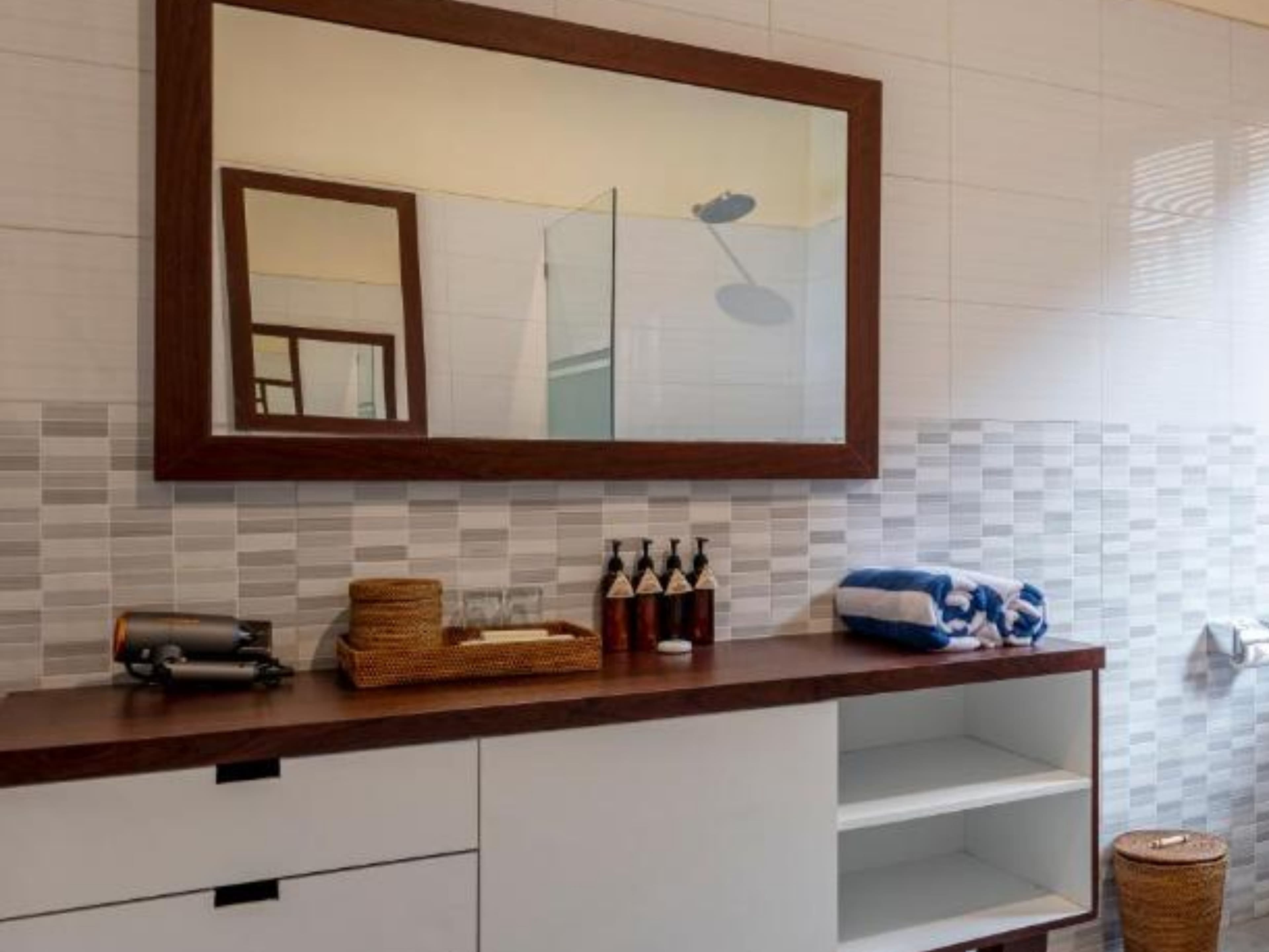 Deluxe Double Room — bathroom mirror and vanity