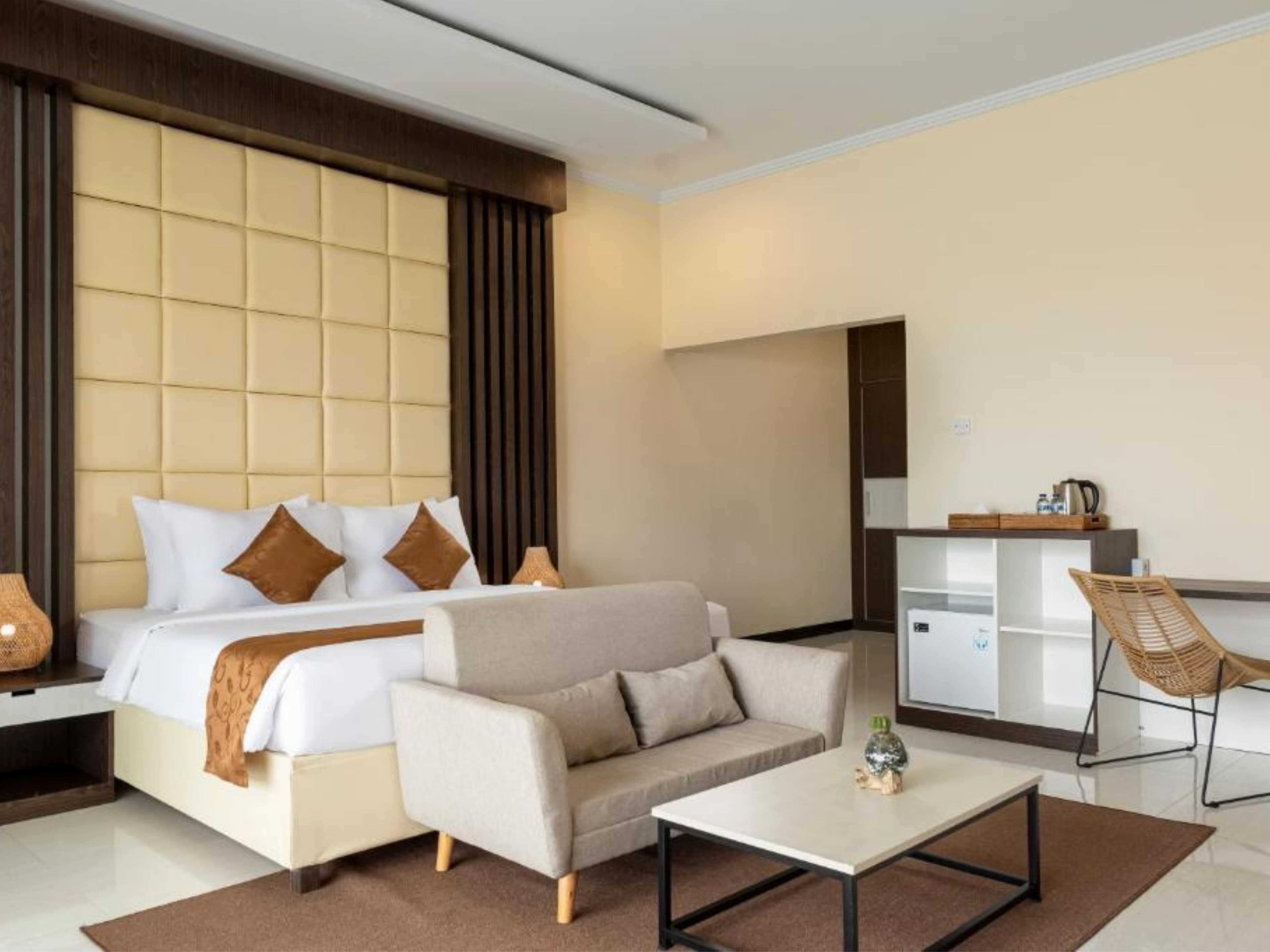 Deluxe Double Room — main bedroom with sofa