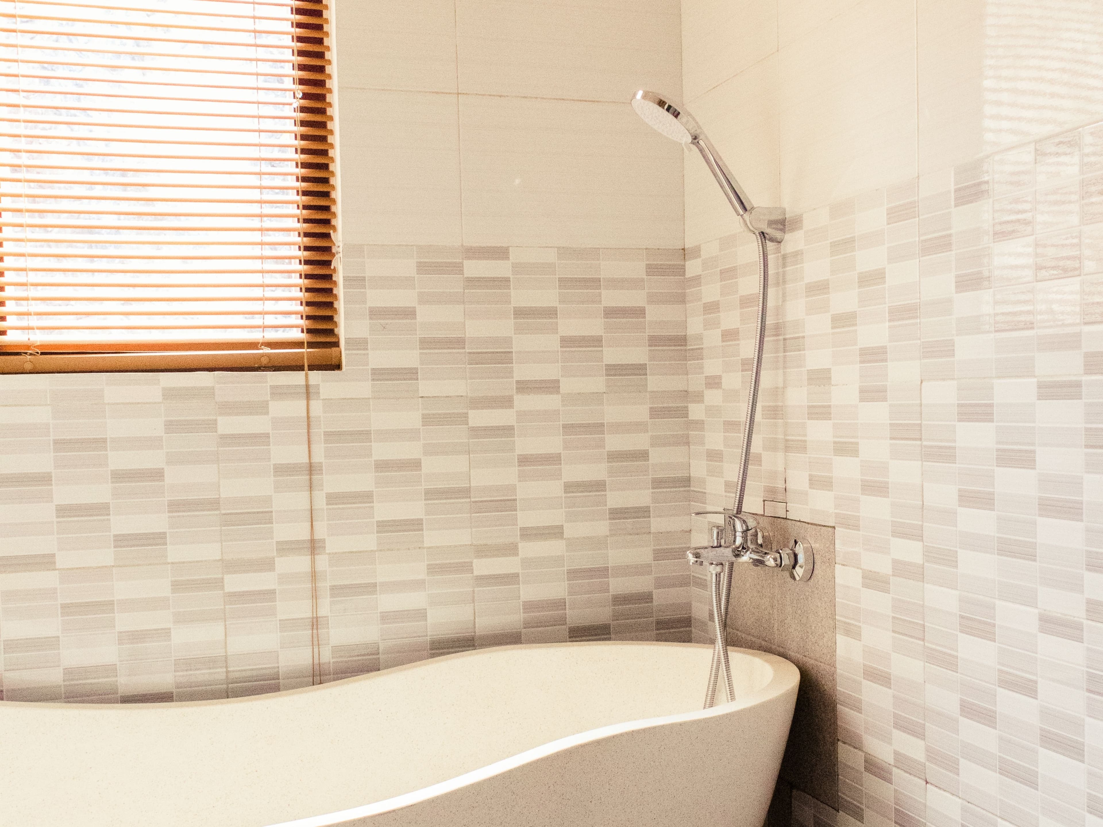 Two-Bedroom Villa — bathroom with freestanding bathtub and rain shower